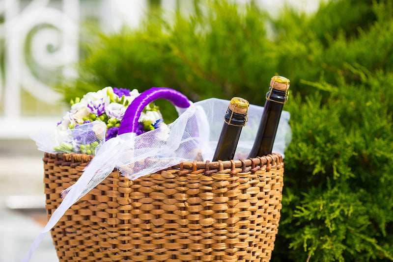 Gift basket filled with wine and flowers
