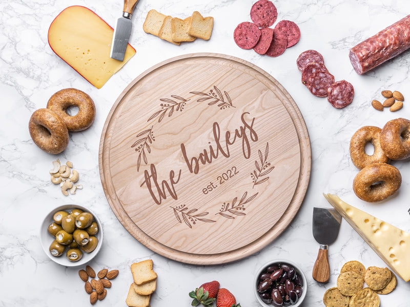 Round charcuterie board with wreath design