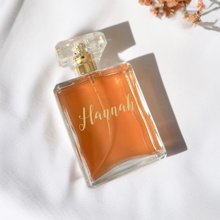 Refillable perfume bottle with custom laser engraving and gold accents